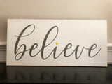 believe script wood sign
