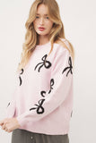 Pink sweater with black bows