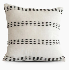 White pillow with black accent